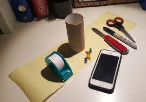 วิธีทำขาตั้ง iPhone ราคาถูกโดยใช้ม้วนกระดาษชำระและหมุด 